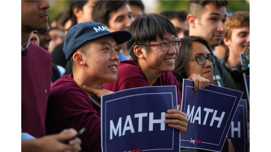 FILE - Supporters listen as Democratic U.S. presidential candidate Andrew Yang speaks during a rally in Cambridge, Mass., Sept. 16, 2019.
