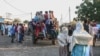 People fleeing intense fighting in Ethiopia's Tigray region gather in the bordering Sudanese village 8, east of the town of Gadaref, Nov. 13, 2020. 