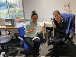 Tammy Thao Pham (left) and Kati Nguyen (right) make masks for Seattle-area health care workers. (Photo from Facebook)