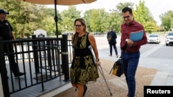 FILE - U.S. Sen. Kyrsten Sinema, D-Ariz., arrives to deliver a speech on the U.S. Senate floor, Aug. 9, 2021.