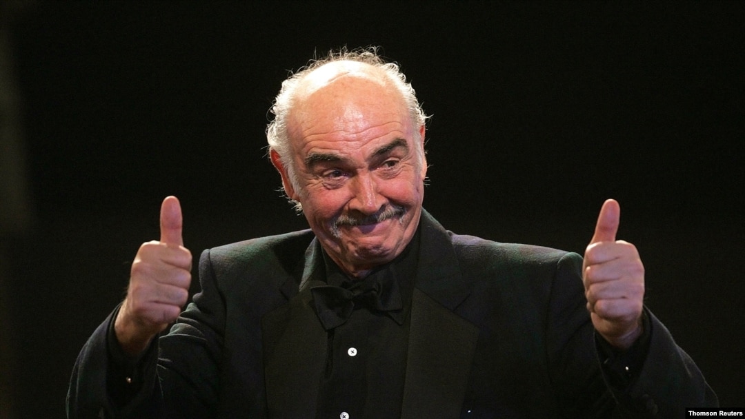 FILE - British actor Connery reacts on stage during European film award ceremony in Berlin, Dec. 3, 2005. 