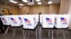 FILE - Poll workers with the Hillsborough County Supervisor of Elections Office work to set up early voting equipment at the Seffner-Mango Branch Library in Seffner, Florida, August 2, 2024. 