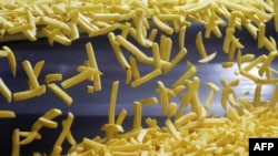 FILE: French fries are seen at Mydibel Group factory, a manufacturer of chilled, frozen and dehydrated potato products, in Mouscron, Belgium on April 29, 2020.