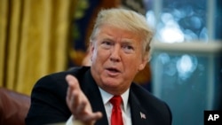 FILE - President Donald Trump speaks during an interview with The Associated Press, Oct. 16, 2018.