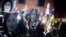 FILE - People hold pictures of journalist Daphne Caruana Galizia, who was slain in October 2017, as they protest in Valletta, Malta, Nov. 29, 2019.