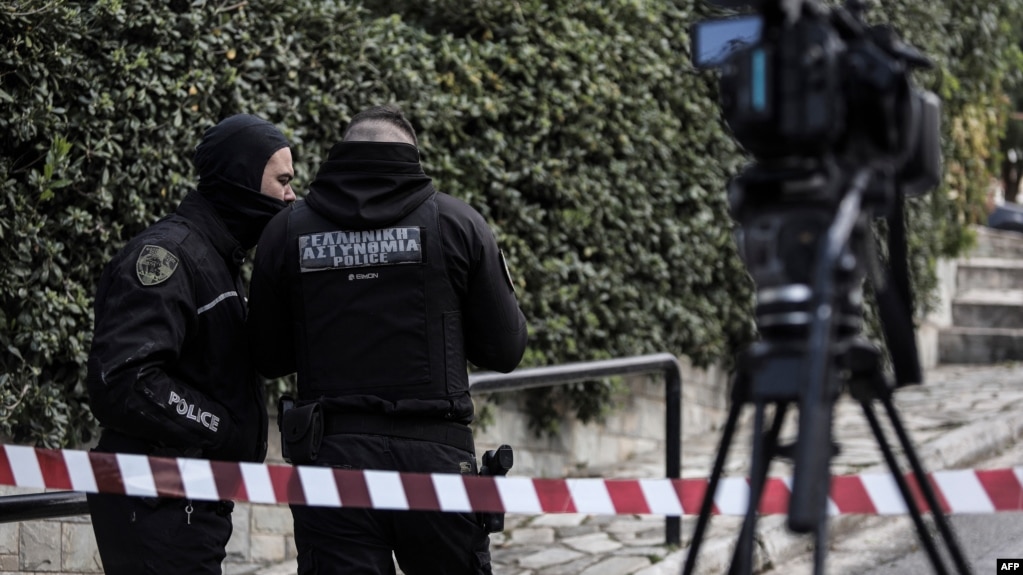 Greek police set up a security perimeter near the house of Giorgos Karaivaz, a veteran crime journalist, after he was shot dead in Athens, April 9, 2021.