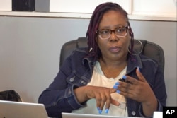 In this image taken from video, Rose-Thamar Joseph, from the Haitian Community Help and Support Center, speaks to The Associated Press, Sept. 11, 2024, in Springfield, Ohio.