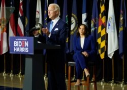 Democratic presidential candidate former Vice President Joe Biden, joined by his running mate Sen. Kamala Harris, speaks during a campaign event at Alexis Dupont High School in Wilmington, Del., Aug. 12, 2020.