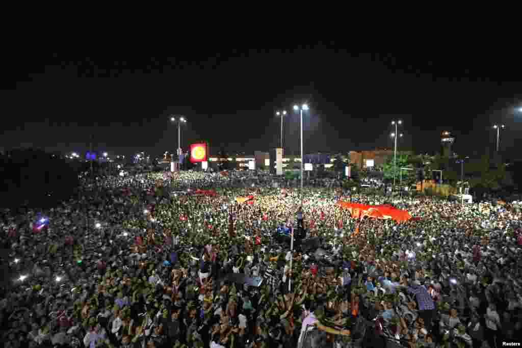 People demonstrate outside Ataturk international airport during an attempted coup in Istanbul, Turkey, July 16, 2016.