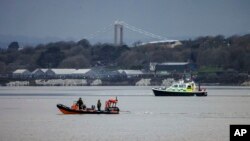 In this photo provided by the British Ministry of Defense on Feb. 23, 2024, the Royal Navy Bomb Disposal Team leaves the slip to Torpoint Ferry preparing to dispose of a WWII bomb discovered in Plymouth.