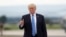 President Donald Trump gives a thumbs-up as walks to board on Air Force One at Hagerstown Regional Airport in Hagerstown, Md., Friday, Aug. 18, 2017, following a national security meeting at Camp David. 