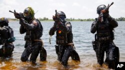 FILE - Ghanaian soldiers conduct combat drills during Flintlock 2023 at Sogakope beach resort, Ghana, March 14, 2023. Soldiers from several African countries were trained in counter-insurgency tactics as part of this annual U.S.-led exercise. 