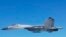 FILE - A Chinese SU-27 fighter flies over the East China Sea, in this handout photo taken May 24, 2014 and released by the Defense Ministry of Japan