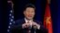 Chinese President Xi Jinping talks about how the Chinese symbol for the word "people" resembles two sticks supporting each other as he speaks Tuesday, Sept. 22, 2015.