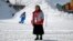 In this Feb. 12, 2018 photo, Sungsook Kim, a Catholic nun who goes by her religious name, Sister Droste, poses for a photograph at Phoenix Snow Park during the 2018 Winter Olympics in Pyeongchang, South Korea. Droste runs several centers spread across the sprawling Olympics venues to help sexual assault victims during the Winter Games.