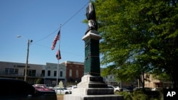 FILE - A weather-worn tarp covers the century-old Confederate monument in Grenada, Miss., April 12, 2023. On Sept. 11, 2024, the town took down the monument, which had been there since 1910. 