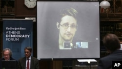 National Security Agency leaker Edward Snowden speaks via video link during the Athens Democracy Forum, organized by the New York Times, at the National Library in Athens on Sept. 16, 2016.