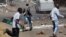 Opposition party supporters clash with police in Harare, Zimbabwe, Aug. 26, 2016.