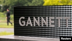 FILE - The logo of Gannett Co is seen outside their corporate headquarters in McLean, Virginia, July 23, 2013. ( REUTERS/Larry Downing//File Photo)