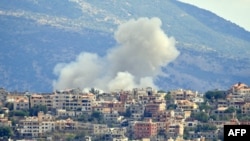 Smoke billows from the site of an Israeli airstrike in the southern Lebanese village of Khiam near the border on Sept. 19, 2024.