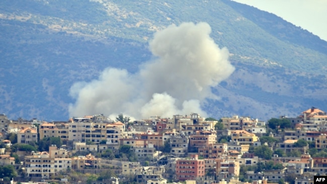 Smoke billows from the site of an Israeli airstrike in the southern Lebanese village of Khiam near the border on Sept. 19, 2024.