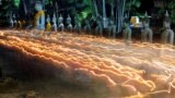 Buddhists carry candles as they pray during Vesak Day, an annual celebration of Buddha&#39;s birth, at Wat Yai Chai Mongkhon temple in Ayutthaya, Thailand.