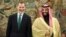 Saudi Arabia's Crown Prince Mohammed bin Salman laughs with Spain's King Felipe at the Zarzuela Palace outside Madrid, Spain, Apr. 12, 2018. 