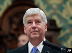 FILE - Former Michigan Gov. Rick Snyder delivers his State of the State address at the state Capitol in Lansing, Mich., Jan. 23, 2018.