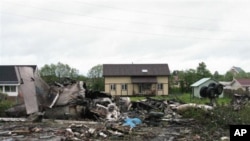 A view shows the site of a plane crash near the airport outside the northern Russian city of Petrozavodsk, June 21, 2011