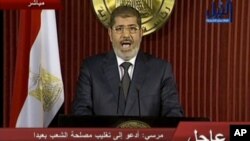 In this image made from video, Egyptian President Mohammed Morsi delivers a televised statement in Cairo, Egypt, Thursday, Dec. 6, 2012.
