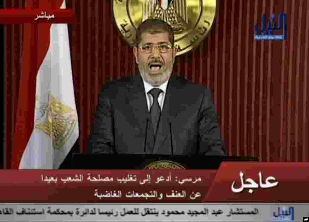 In this image made from video, Egyptian President Mohammed Morsi delivers a televised statement in Cairo, Egypt, Thursday, Dec. 6, 2012.