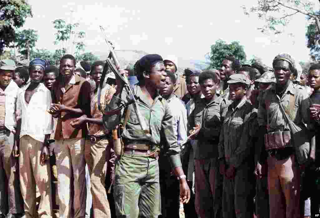 Members of the black nationalist guerrillas of the Zimbabwean African Liberation Army (ZALA), led by Robert Mugabe, staging a rally in an unknown place in Zimbabwe, February 6, 1980. (AFP)