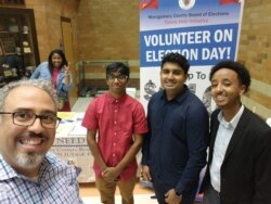 Rohan Rajesh, (second right) with fellow students and Gilberto Zelaya, vice president of the Montgomery County Board of Elections (far left), at Clarksburg High School in Clarksburg, Maryland, October 2019. (Photo courtesy of Rohan Rajesh)