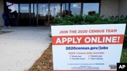 A sign is seen outside of IDES (Illinois Department of Employment Security) WorkNet center in Arlington Heights, Ill., Nov. 5, 2020. 