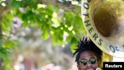 FILE - Khalil Brass of the Brothers of Brass performs at an event to mark Juneteenth, a salute to the day when the last enslaved African Americans learned they were free, in Denver, June 20, 2020. Juneteenth will soon be an official national holiday.