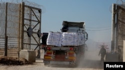 A truck carries humanitarian aid destined for the Gaza Strip, amid the ongoing conflict in Gaza between Israel and Hamas, at the Kerem Shalom crossing in southern Israel, Nov. 11, 2024.