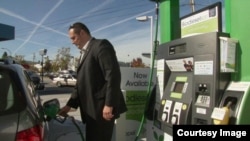 A motorist fuels up on algae-based biodiesel during a month-long test run of the product in the San Francisco Bay area. (Courtesy Solazyme)