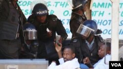 Two journalists who were arrested for covering a public protest freelancer Robert Tapfumaneyi and Newsday's Obey Manati.