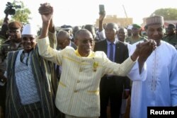 FILE—Prime Minister of Niger, Prime Minister of Burkina Faso and Prime Minister of Mali, attend a sit-in in Niamey