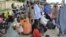 Civilians who fled their homes following an attacked by Islamist militants in Bama, take refuge at a School in Maiduguri, Nigeria, Sept. 3, 2014.