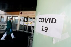 A COVID-19 sign is seen at the Policlinico Tor Vergata hospital where patients suffering from the coronavirus disease are being treated in Rome, Italy, Nov. 13, 2020.