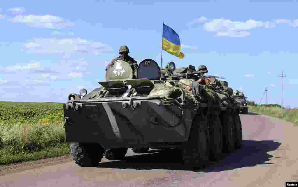 A military vehicle bearing a Ukrainian flag at a checkpoint near Slaviansk in eastern Ukraine, July 3, 2014.