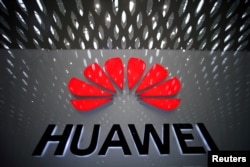 FILE PHOTO: A Huawei company logo at Shenzhen International Airport in Shenzhen, Guangdong province, China, July 22, 2019.