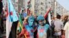 Supporters of southern separatists with their faces painted with the colors of the South Yemen during a rally to show support to the UAE amid a standoff with the government, in Aden, Yemen, Sept. 5, 2019.