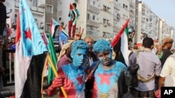 Supporters of southern separatists with their faces painted with the colors of the South Yemen during a rally to show support to the UAE amid a standoff with the government, in Aden, Yemen, Sept. 5, 2019.