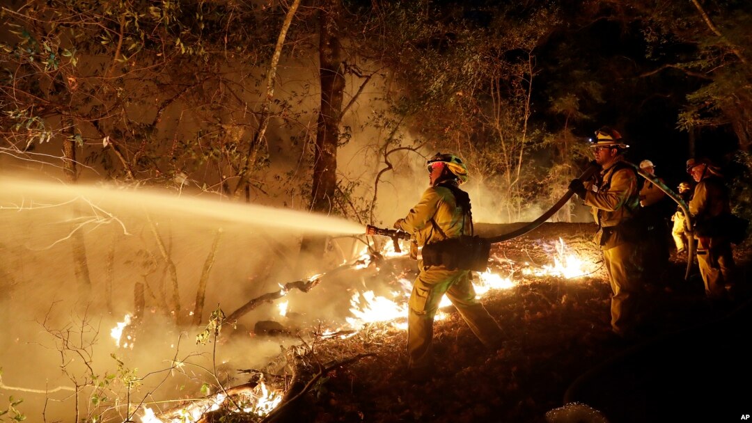 Fire crews battle a wildfire in Santa Rosa, California, Oct. 14, 2017.