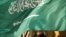 FILE - An embassy honor guard member is covered by the flag of Saudi Arabia, in Washington, March 22, 2018. The kingdom, on Feb 27, 2024, executed seven individuals for "creating and financing terrorist organizations and entities," its interior ministry said.