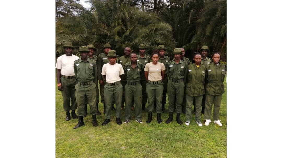 Female rangers at the Olgulului-Ololarashi Group Ranch pose for a group photo with their male colleagues. (Courtesy - Patrick Papatiti, Commander of the Olgululului Community Wildlife Rangers)
