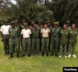 Female rangers at the Olgulului-Ololarashi Group Ranch pose for a group photo with their male colleagues. (Courtesy - Patrick Papatiti, Commander of the Olgululului Community Wildlife Rangers)