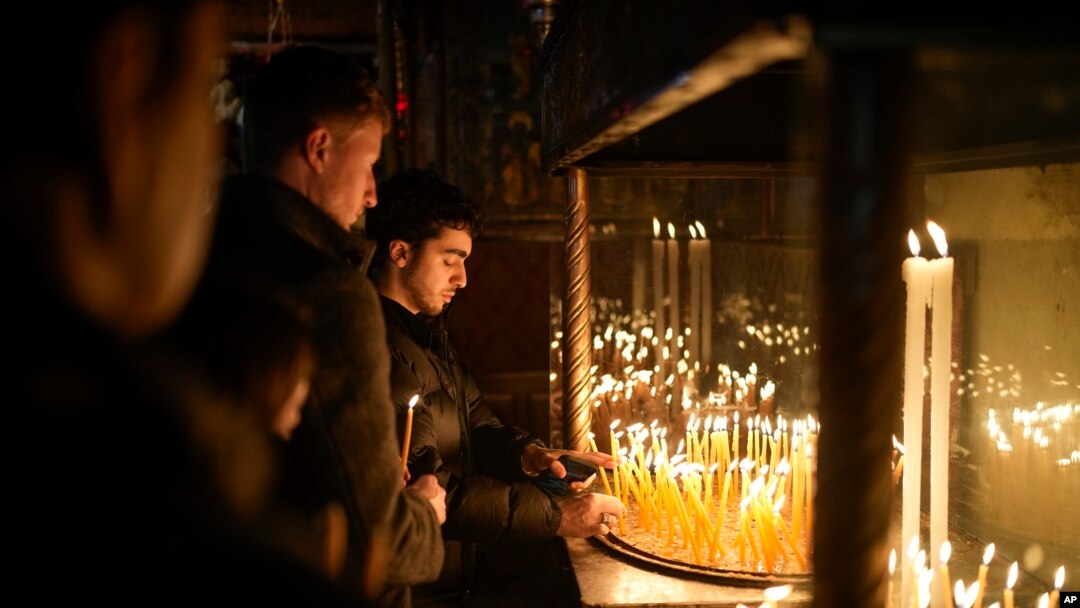 Faithful pray at the Church of the Nativity, traditionally believed to be the birthplace of Jesus, in the West Bank city of Bethlehem, Dec. 24, 2024. 